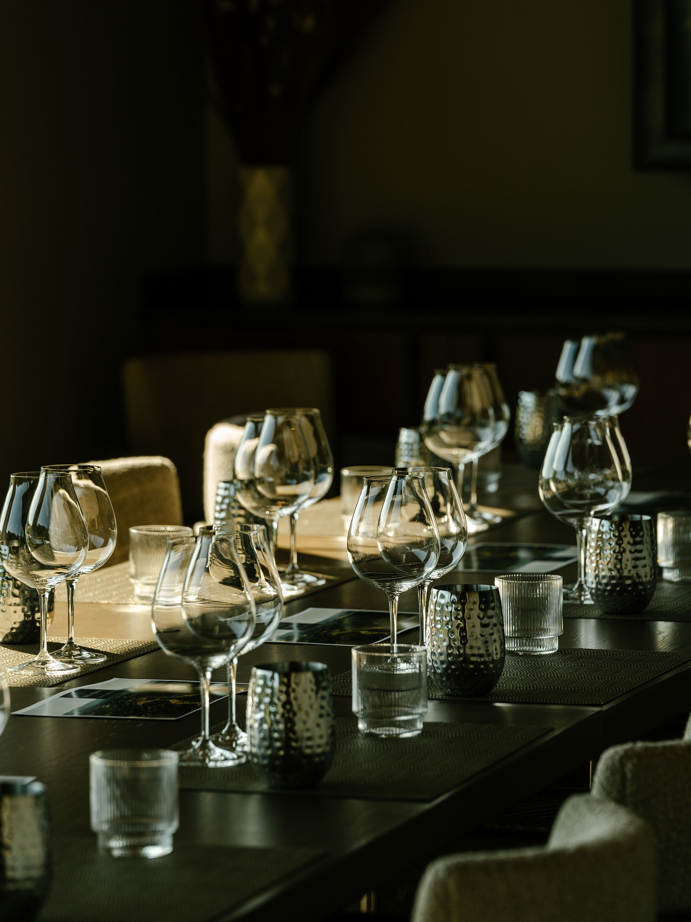 Various bottles of wine at WillaKenzie on wooden table in the estate lounge. Various bottles of wine at WillaKenzie on wooden table in the estate lounge.